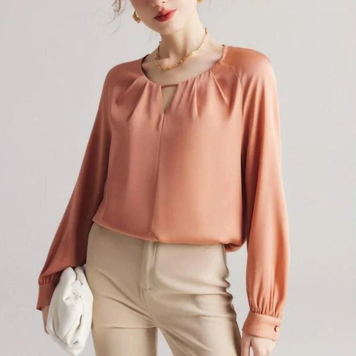 Elegant silk blend raglan sleeve blouse with timeless design and flattering fit for modern women