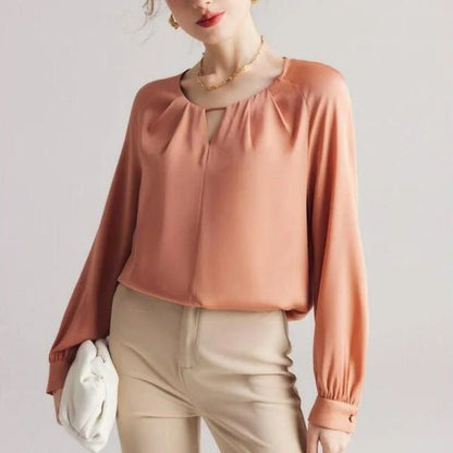 Elegant silk blend raglan sleeve blouse with timeless design and flattering fit for modern women