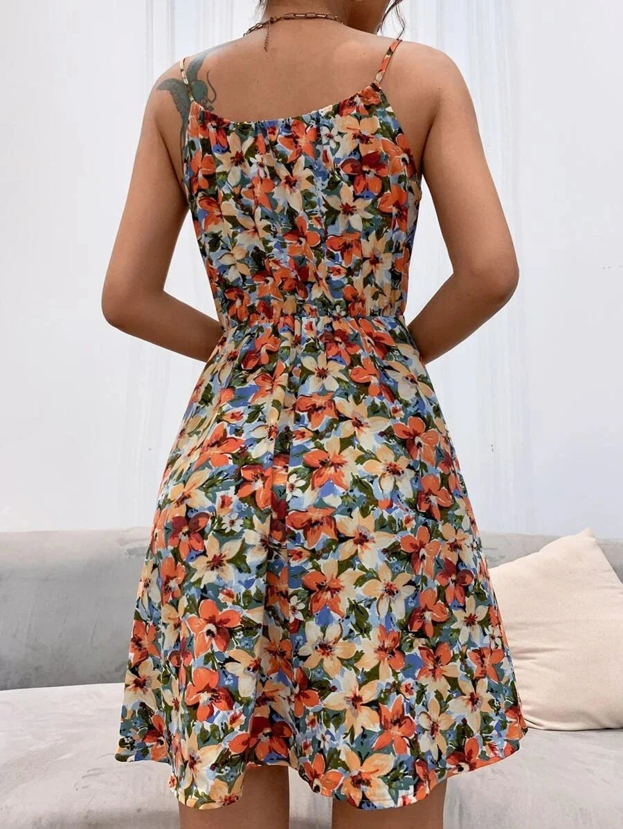 A stylish floral print suspender dress with an elastic waist, perfect for summer fashion and casual or dressy occasions.