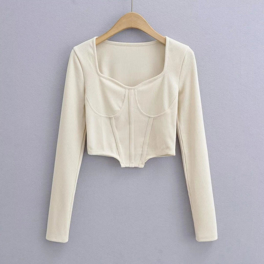 A stylish slim-fit short autumn top with an open waist design, made of premium polyester fabric with long sleeves and a square collar.