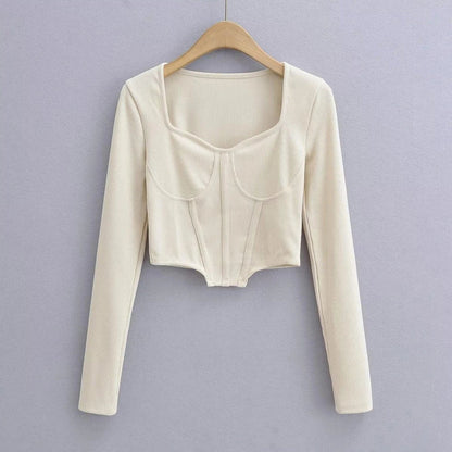 A stylish slim-fit short autumn top with an open waist design, made of premium polyester fabric with long sleeves and a square collar.