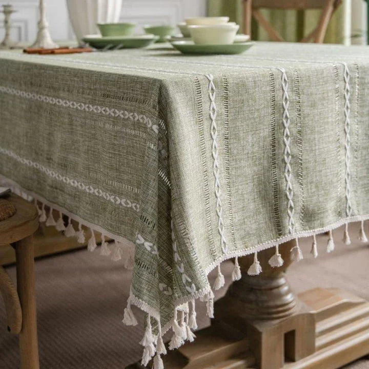 Elegant hollowed-out green tablecloth with a sophisticated and rustic design, perfect for American-style dining and events