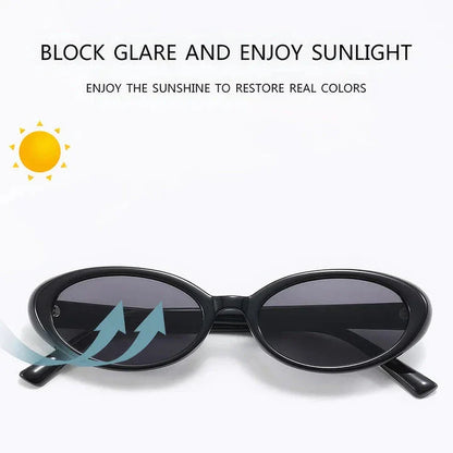 Chic oval sunglasses with white grey acetate frames and polycarbonate lenses, designed for fashionable women to shield their eyes from UV rays in style.