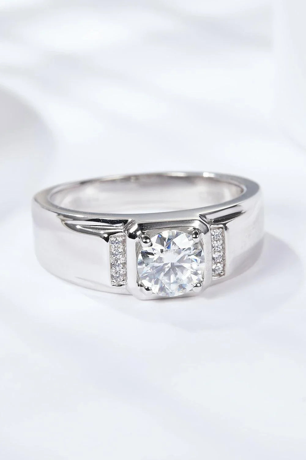 Exquisite 1 carat moissanite ring in 925 sterling silver with platinum plating, showcasing a minimalist and versatile design.
