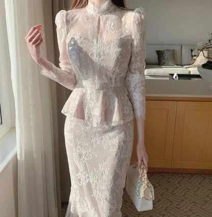 Elegant stand collar blouse with lace crocheted design and ruffled fishtail skirt in white and black colors