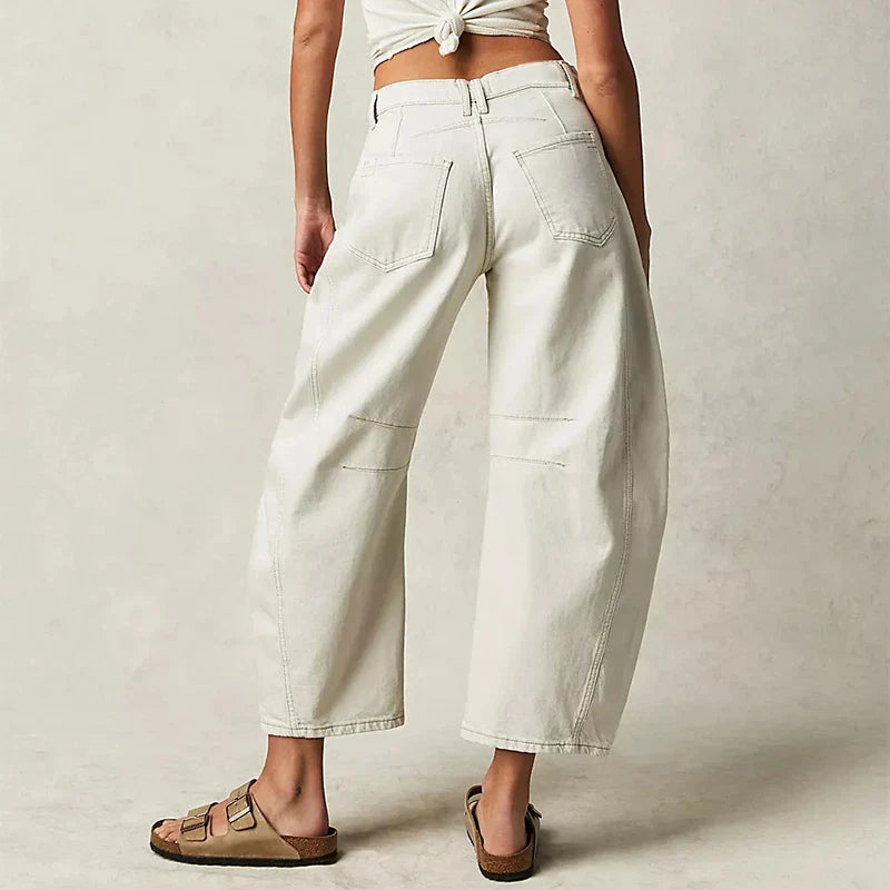 Trendha wide-leg summer pants in light blue, white, and black colors with a relaxed, stylish design