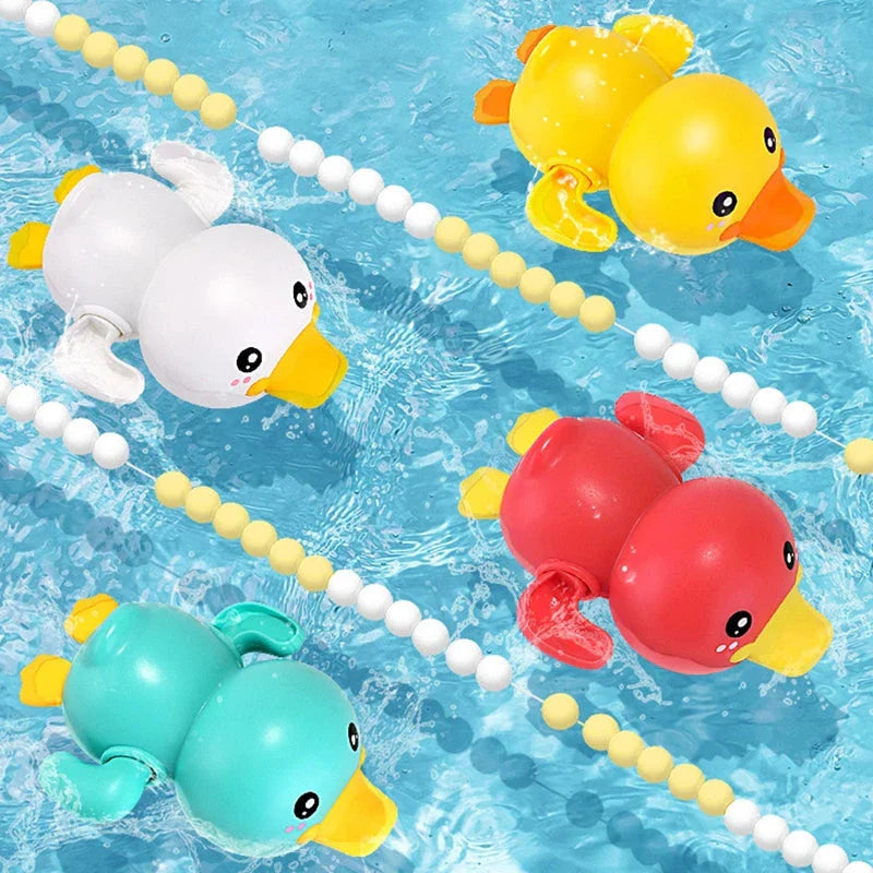 A set of colorful clockwork bathing ducks swimming in the water, providing fun and engaging bath time entertainment for children aged 0-6 years.