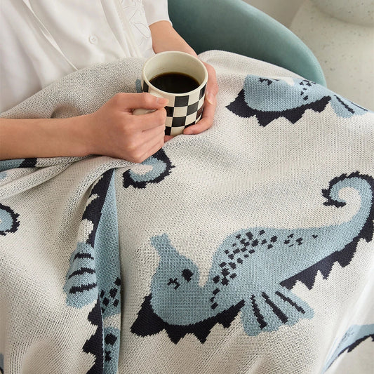 Cozy cotton blanket with cute sea horse design, perfect for relaxation and comfort