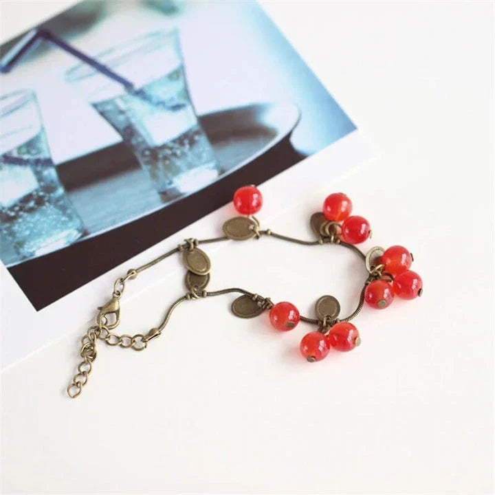 Boho vintage-inspired cherry coin bracelet with adjustable lobster-claw clasp, perfect for girls' summer fashion