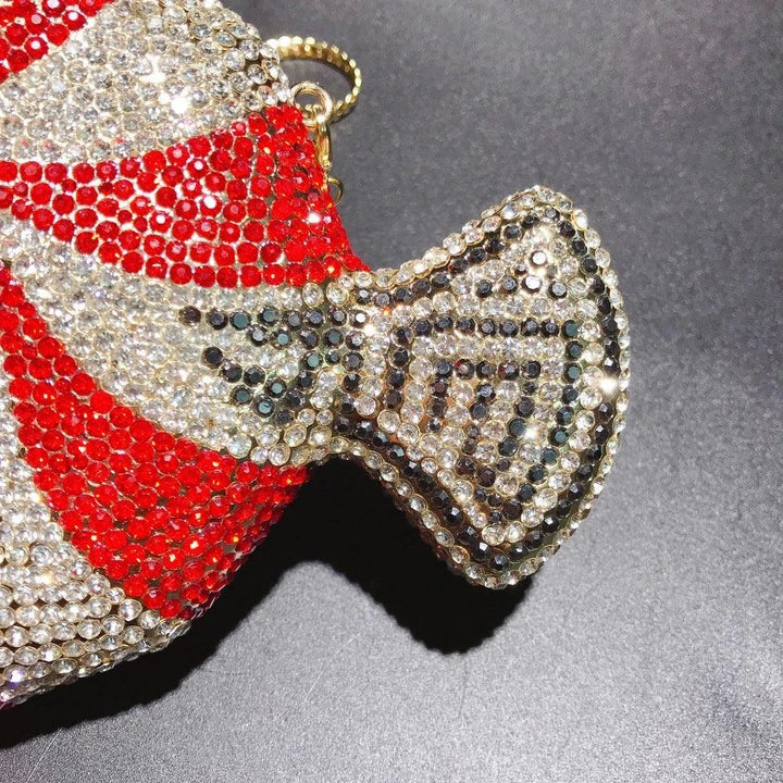 A stylish candy-shaped bag adorned with sparkling rhinestones, featuring a compact and versatile design perfect for everyday use.