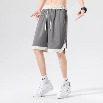 Men's loose and comfortable sports pirate shorts in white, gray, and black colors with elasticized waistband and relaxed fit