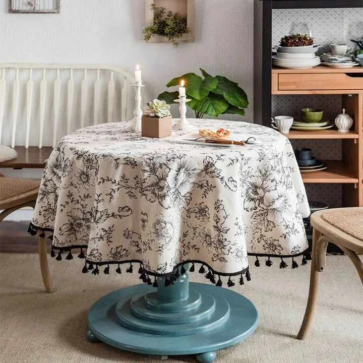 Elegant floral cotton linen round tablecloth with tassels, perfect for dining, kitchen, and home decor