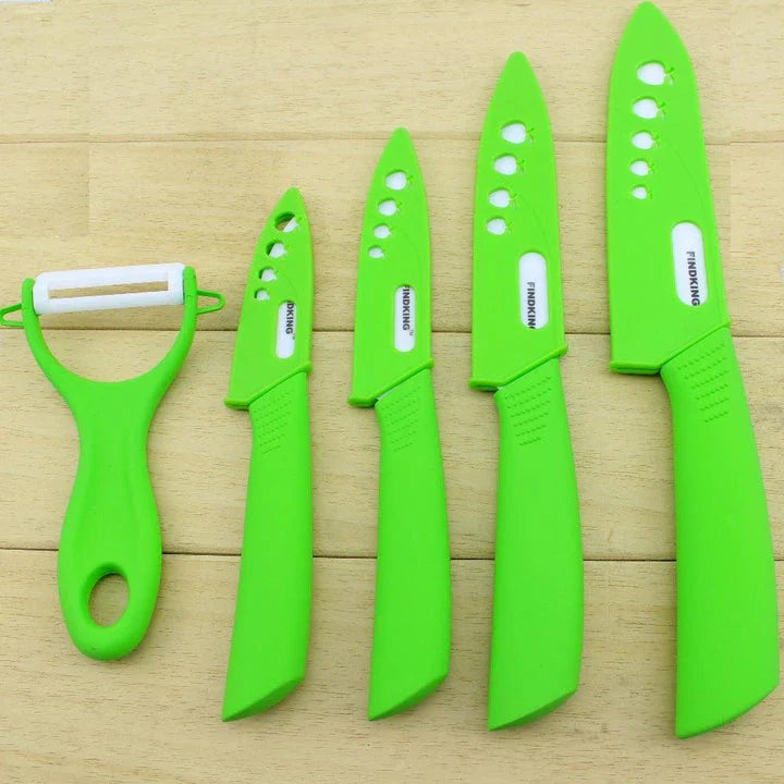 Vibrant ceramic knives in various colors, including red, blue, green, black, yellow, and orange, arranged on a white background.