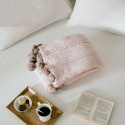 Cozy chenille ball-knit wool blanket in pink, gray, and white colors