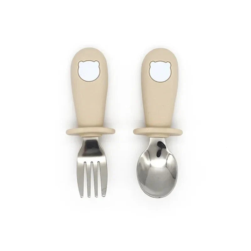 Cartoon Stainless Steel Kids' Cutlery Set with spoon and fork in playful designs, perfect for toddler and child mealtime
