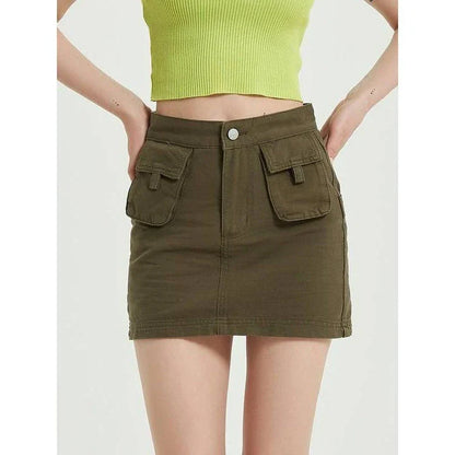Chic green denim high-waist pencil skirt with convenient pockets, offering a flattering and versatile look for any occasion.