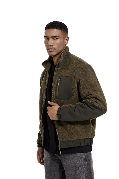 A cozy and stylish men's fleece jacket with a standing collar and convenient side pockets, available in a range of classic colors.