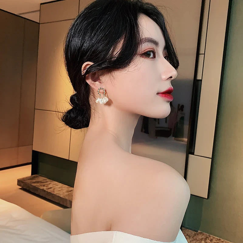 Elegant Baroque pearl earrings with a shimmering alloy, silver, or gold-plated finish