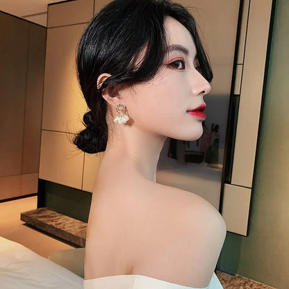 Elegant Baroque pearl earrings with a shimmering alloy, silver, or gold-plated finish