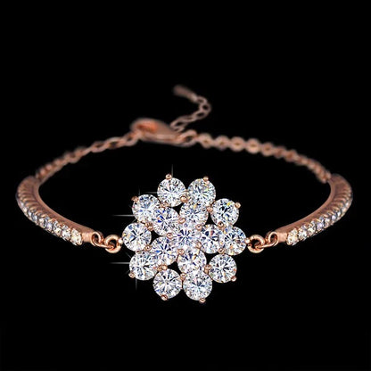 Elegant rose gold cubic zirconia bracelet with intricate cross, crown, and Roman numeral design