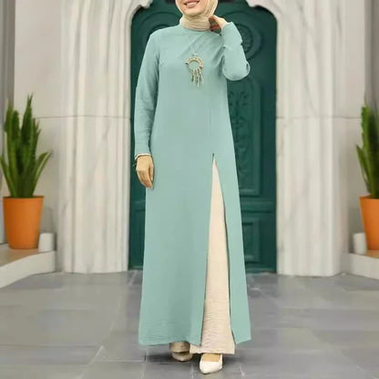 Elegant polyester dress with long sleeves, high slit hem, and available in caramel, black, blue, green, and pink colors