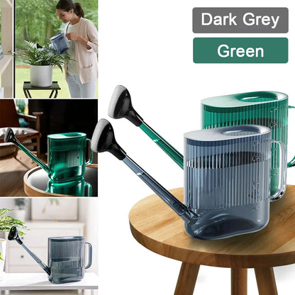 A large, dark grey gardening watering can with a long spout and sprinkler head for efficient, hassle-free plant watering