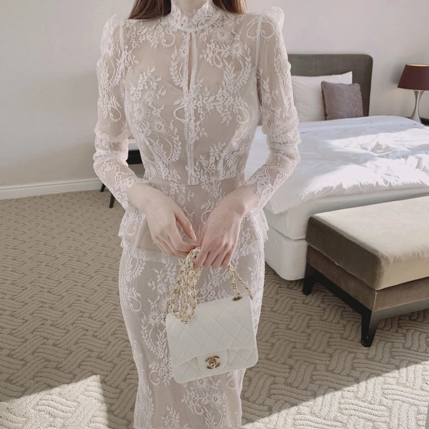 Elegant stand collar blouse with lace crocheted design and ruffled fishtail skirt in white and black colors