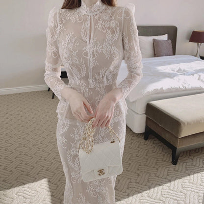 Elegant stand collar blouse with lace crocheted design and ruffled fishtail skirt in white and black colors