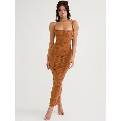 Elegant black maxi dress with spaghetti straps and a backless design, perfect for summer events and nights out.