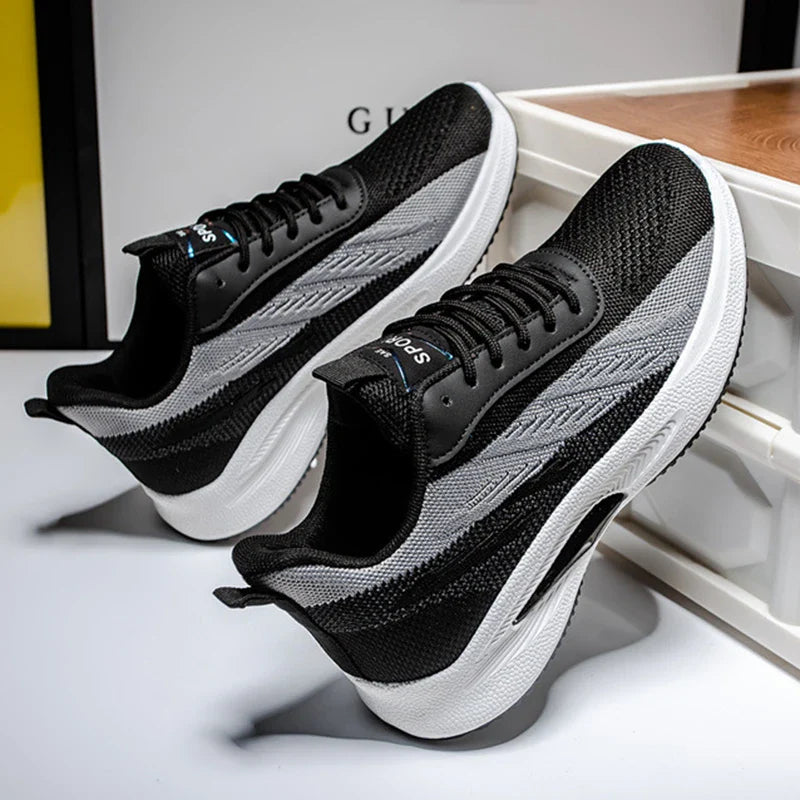 Breathable, comfortable color-blocked mesh sneakers for men with a durable rubber sole and secure lace-up closure