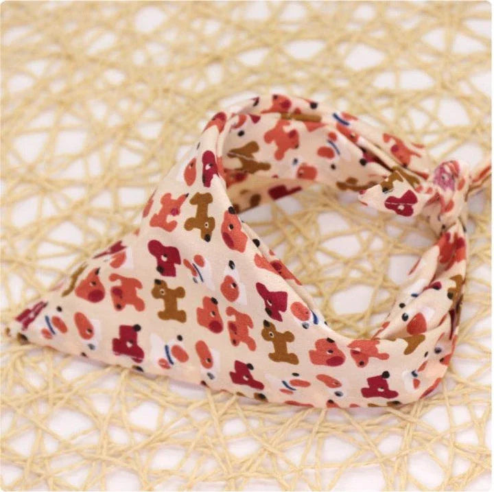 Adorable Cartoon Patterned Triangular Dog Scarf in vibrant colors, perfect for keeping your pup warm and stylish