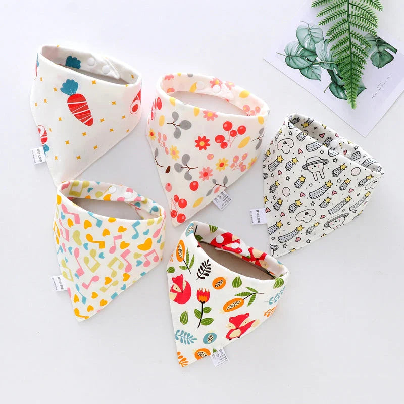 Fashionable cotton baby bandana bibs in various prints, with waterproof backing and adjustable design