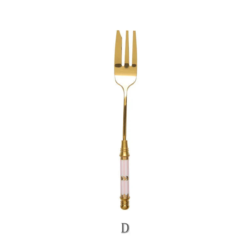 Elegant gold-plated dessert fork with intricate ceramic handle design