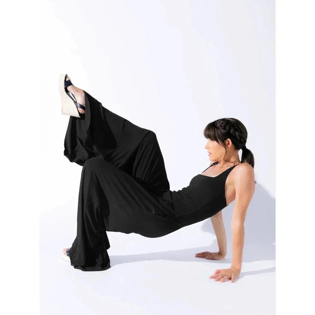 Chic sleeveless jumpsuit with wide-leg pants, made with Rayon and Spandex for comfort and breathability.