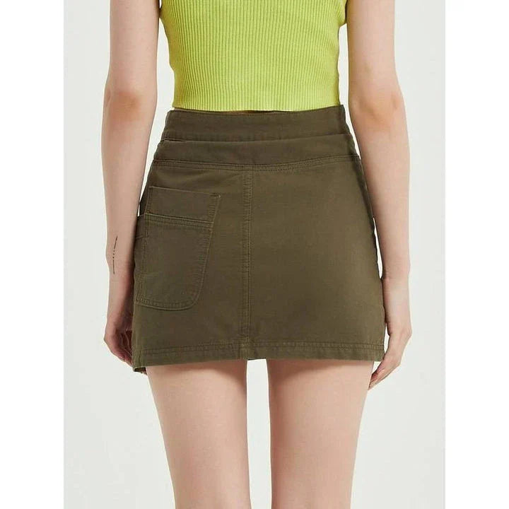 Chic green denim high-waist pencil skirt with convenient pockets, offering a flattering and versatile look for any occasion.