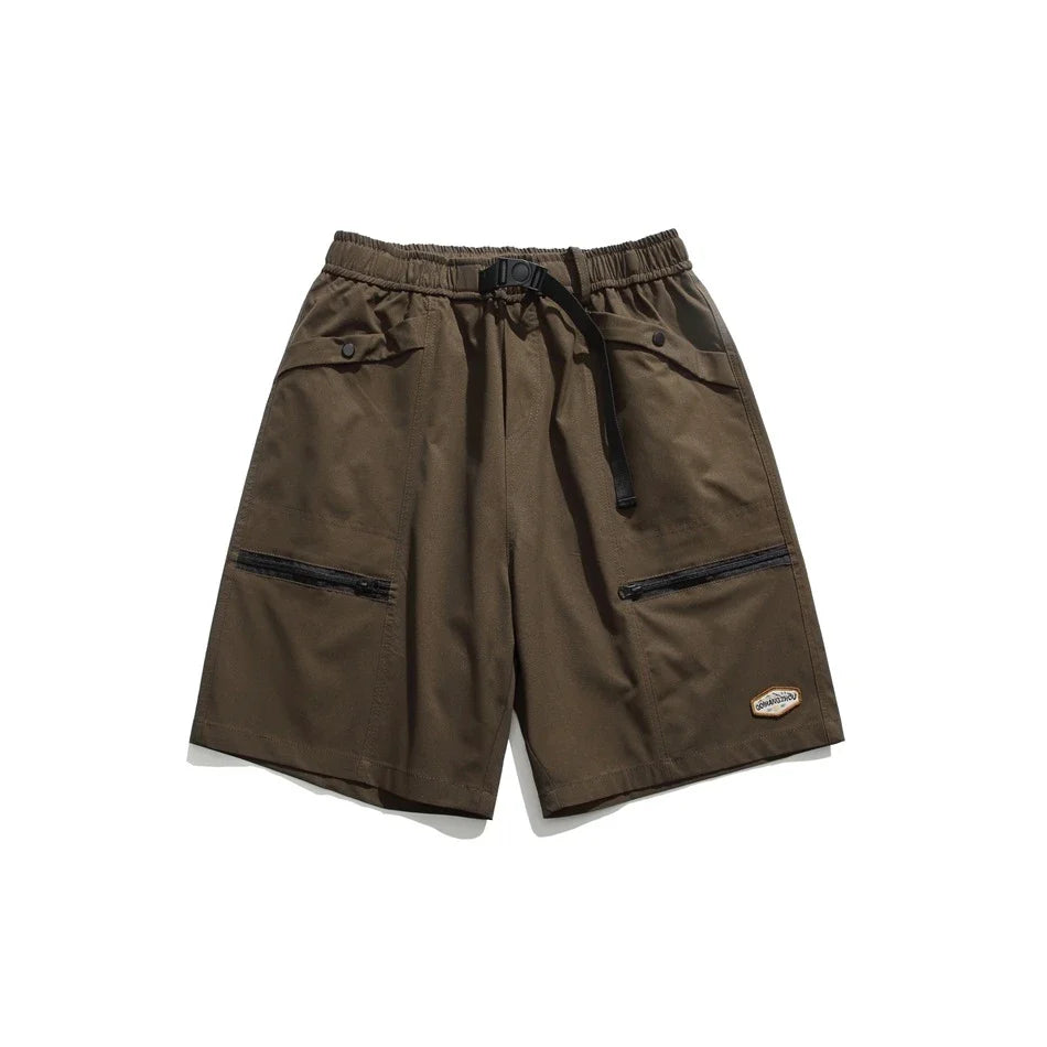 Mountain Vintage Workwear Shorts in black, orange, and army green colors, featuring a fifth-length design and convenient pockets for versatile functionality.