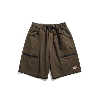Mountain Vintage Workwear Shorts in black, orange, and army green colors, featuring a fifth-length design and convenient pockets for versatile functionality.