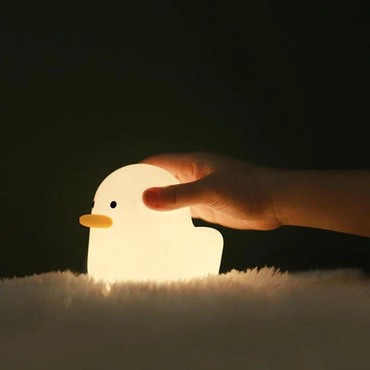 Cute duck-shaped LED night light with silicone and ABS construction, USB charging, and adjustable brightness