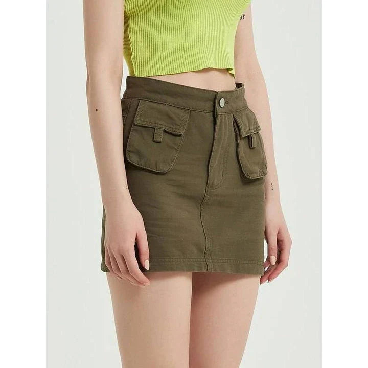 Chic green denim high-waist pencil skirt with convenient pockets, offering a flattering and versatile look for any occasion.