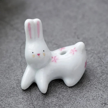 Charming ceramic incense holder featuring a cute rabbit and kitten design, perfect for adding a touch of whimsy and tranquility to any room.