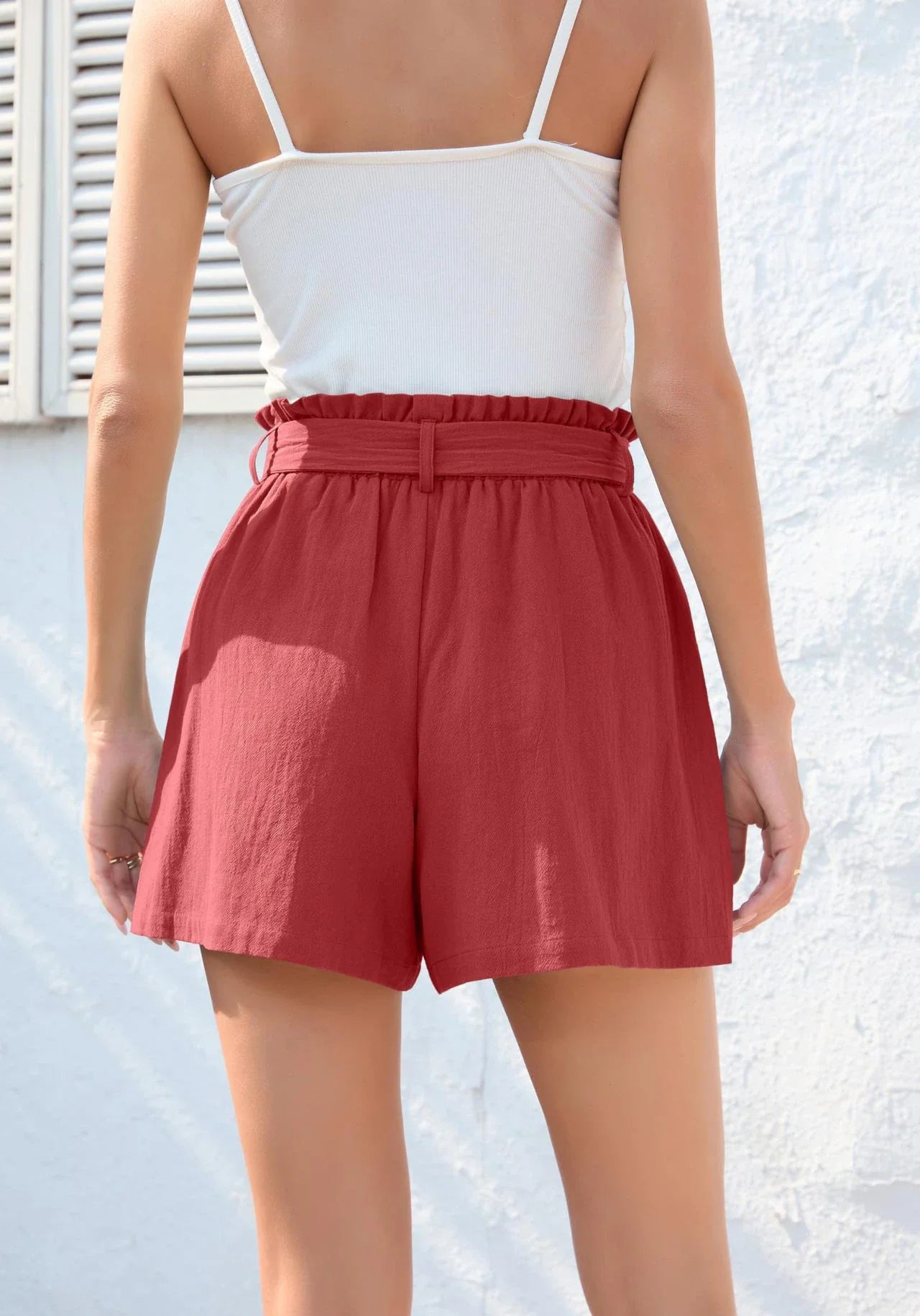 Ruffle bow waist tie shorts in black, made of lightweight and breathable polyester fabric, with convenient pockets for storage