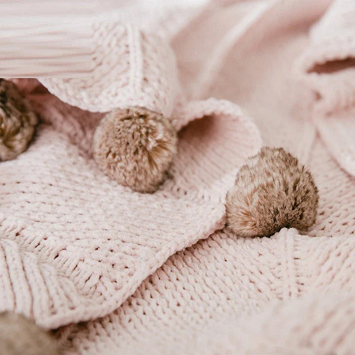 Cozy chenille ball-knit wool blanket in pink, gray, and white colors