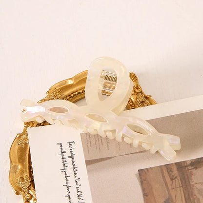 Elegant leopard print large weave hair clip for women and girls, made with durable acrylic and alloy materials for a secure and comfortable hold.