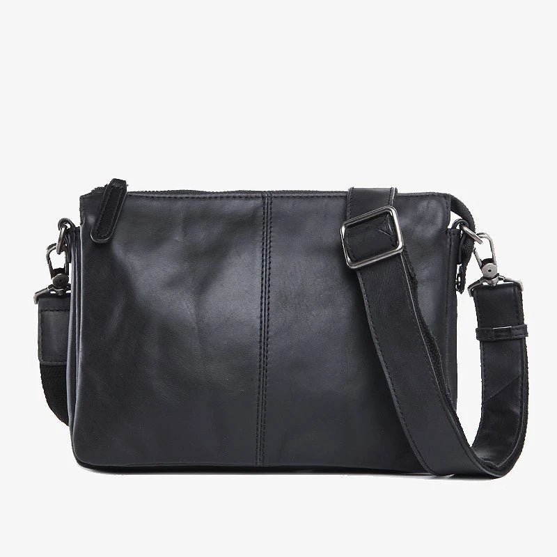 Premium cowhide leather crossbody bag with multiple interior pockets for organized, hands-free carrying