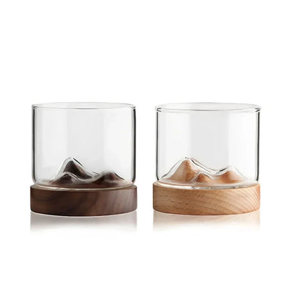 Elegant mountain-inspired whiskey glass with a wooden base, perfect for enjoying a variety of hot and cold beverages