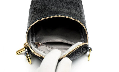 Premium leather crossbody bag with adjustable strap, multiple pockets, and sleek Korean-inspired style