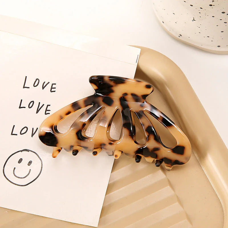 Stylish geometric hollow stripes hair barrettes in beige color, a fashionable accessory to elevate any hairstyle