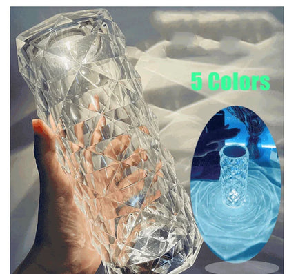 Elegant diamond-inspired crystal lamp with touch-sensitive dimming controls, providing adjustable ambient lighting for bedrooms and living spaces.