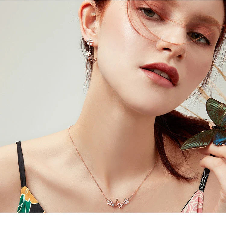 Elegant silver earrings featuring a delicate butterfly design with shimmering white crystals