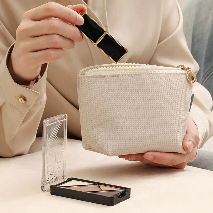 Mini portable waterproof cosmetic bag in beige and gray colors with a foldable design for convenient storage